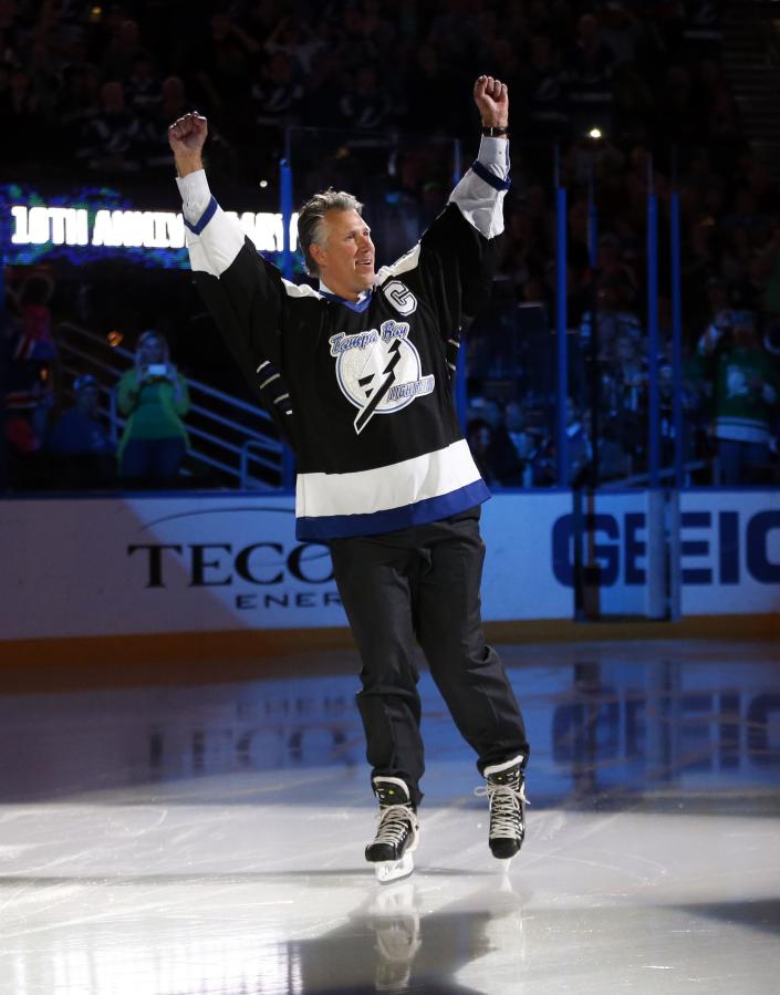 TAMPA, FL - MARCH 17: Dave Andreychuk, former captain of the Tampa Bay Lightning, is introduced as part of the team&#39;s celebration of the tenth anniversary of their Stanley Cup win prior to a game against the Vancouver Canucks at the Tampa Bay Times Forum on March 17, 2014 in Tampa, Florida. (Photo by Mike Carlson/Getty Images)