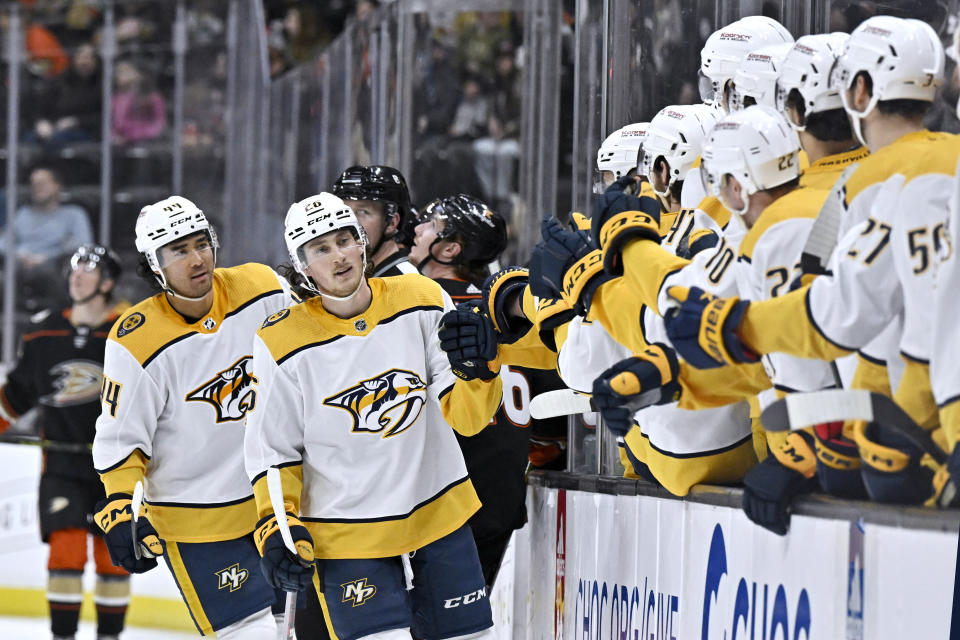 Nashville Predators center Philip Tomasino, second from left, celebrates with teammates after scoring against the Anaheim Ducks during the first period of an NHL hockey game in Anaheim, Calif., Sunday, March 12, 2023. (AP Photo/Alex Gallardo)