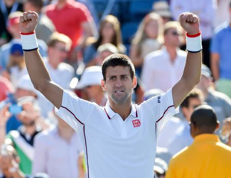 Aug 28, 2014; New York, NY, USA; Novak Djokovic (SRB) celebrates after beating Paul-Henri Mathieu (FRA) on day four of the 2014 U.S. Open tennis tournament at USTA Billie Jean King National Tennis Center. Mandatory Credit: Robert Deutsch-USA TODAY Sports