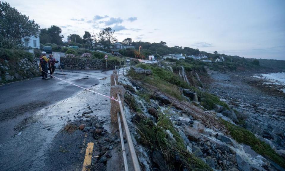 Cornish coastguard and fire and rescue services attend the scene following a flash flood in Coverack.