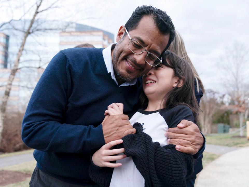 Former Nicaragua presidential candidate Felix Maradiaga hugs his daughter Alejandra after arriving at Dulles International Airport on Thursday 9 February 2023 (Jose Luis Magana/AP)