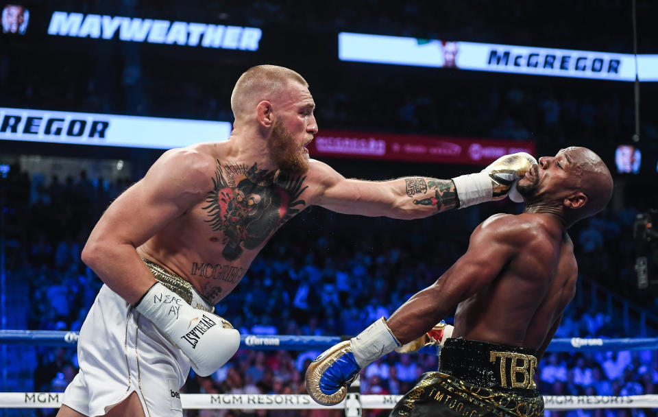 Nevada , United States - 26 August 2017; Conor McGregor, left, and Floyd Mayweather Jr during their super welterweight boxing match at T-Mobile Arena in Las Vegas, USA. (Photo By Stephen McCarthy/Sportsfile via Getty Images)