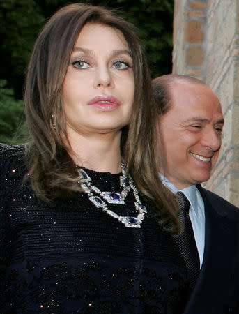 FILE PHOTO: Italy's Prime Minister Silvio Berlusconi and his wife Veronica Lario are seen at Villa Madama in Rome, Italy June 4, 2004. REUTERS/Alessandro Bianchi/File Photo