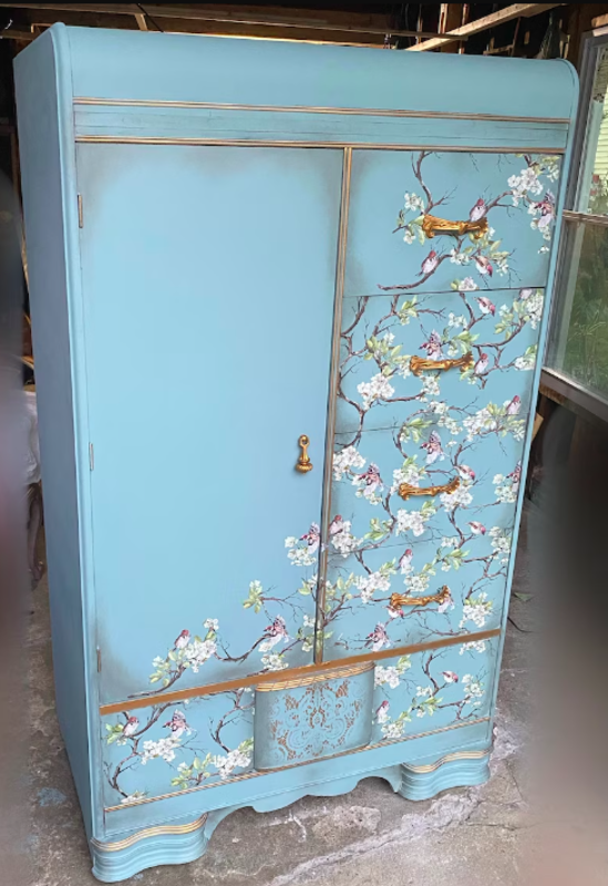 This armoire has been sold so don't try to purchase it on Etsy but LOOK at this inspiration for painting wood.<p><a href="https://www.etsy.com/listing/1214076628" rel="nofollow noopener" target="_blank" data-ylk="slk:Etsy / Timeless Beauty By Maia;elm:context_link;itc:0;sec:content-canvas" class="link ">Etsy / Timeless Beauty By Maia</a></p>