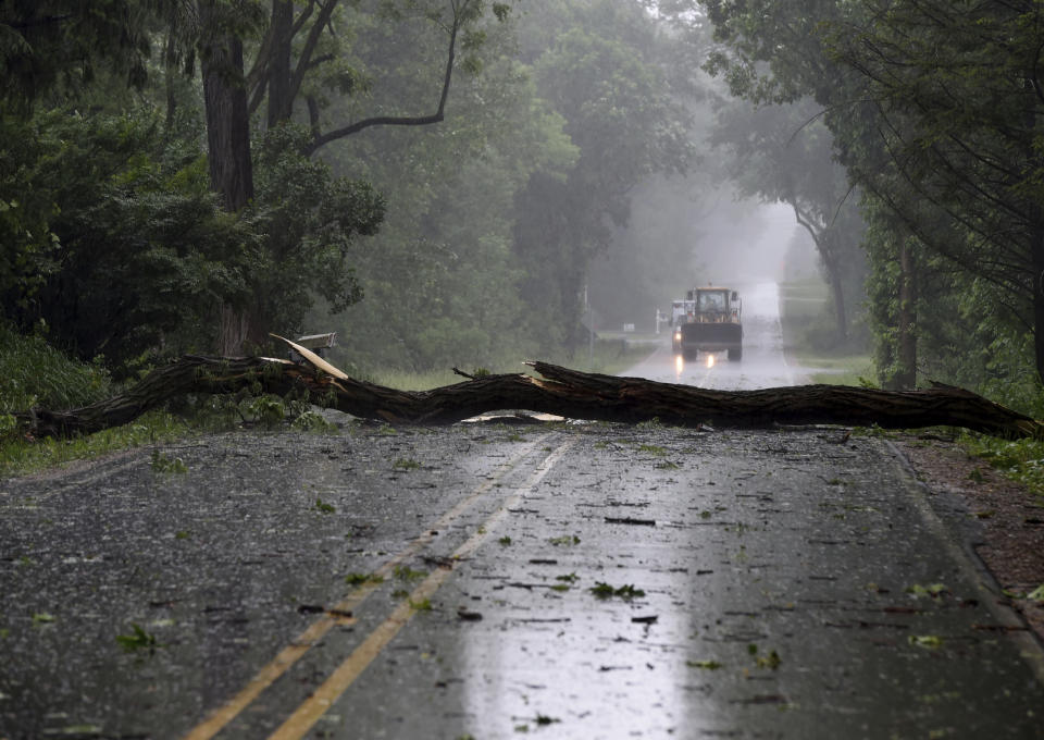 Storm damage is seen on Sandstone Road near McCain Road on Wednesday, June 10, 2020. Strong storms with heavy winds swept across Jackson County, Mich., causing power outages, downing trees and damaging property. (J. Scott Park/Jackson Citizen Patriot via AP)