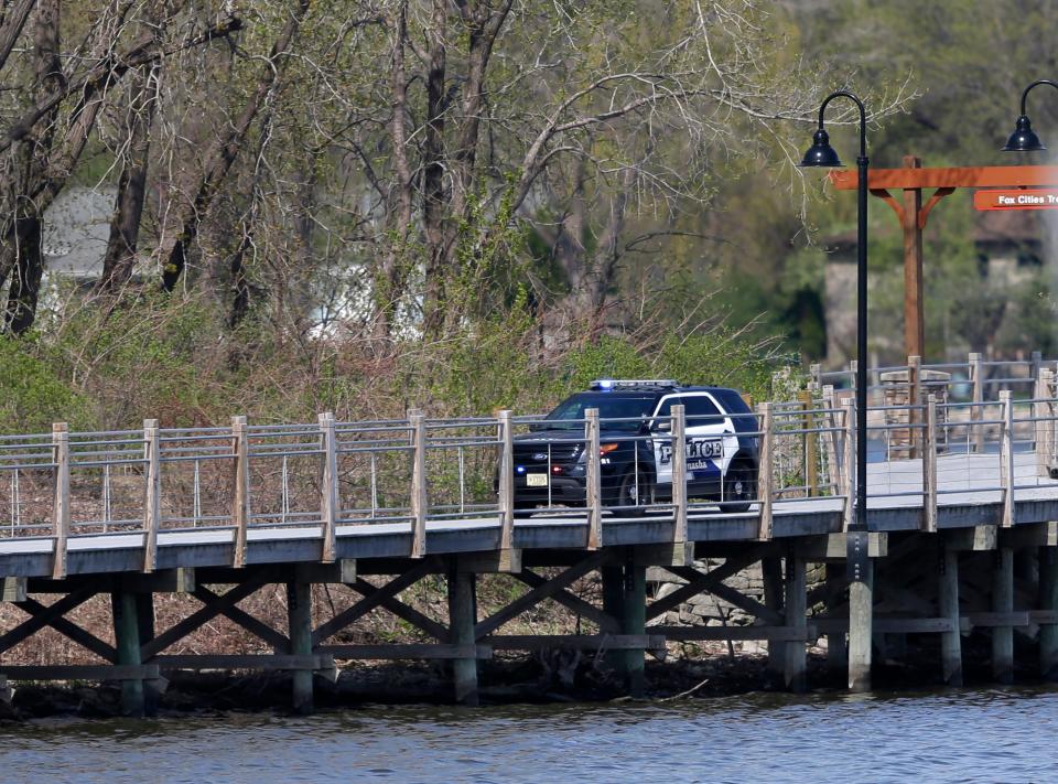 Menasha police investigate a May 3, 2015 shooting that resulted in four deaths and one injury.  The shooting occurred on the Fox Cities Trestle Trail bridge. William Glasheen/Post-Crescent Media