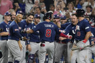 U.S.'s Trea Turner (8) is congratulated by the team after hitting a home run during the second inning at a World Baseball Classic final game against Japan, Tuesday, March 21, 2023, in Miami. (AP Photo/Marta Lavandier)