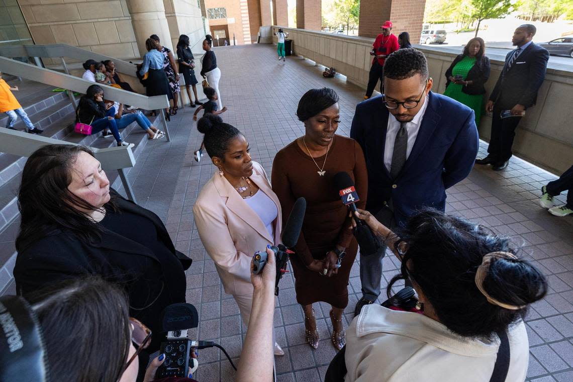 Crystal Mason, center, and her attorneys answer questions regarding her acquittal in a high-profile voting rights case at the Tim Curry Criminal Justice Center in Fort Worth on Friday, March 29, 2024. The Texas Second Court of Appeals reversed Mason’s conviction on Thursday evening where she had faced five years in prison for submitting a provisional ballot in Tarrant County in 2016 that was never counted as a vote