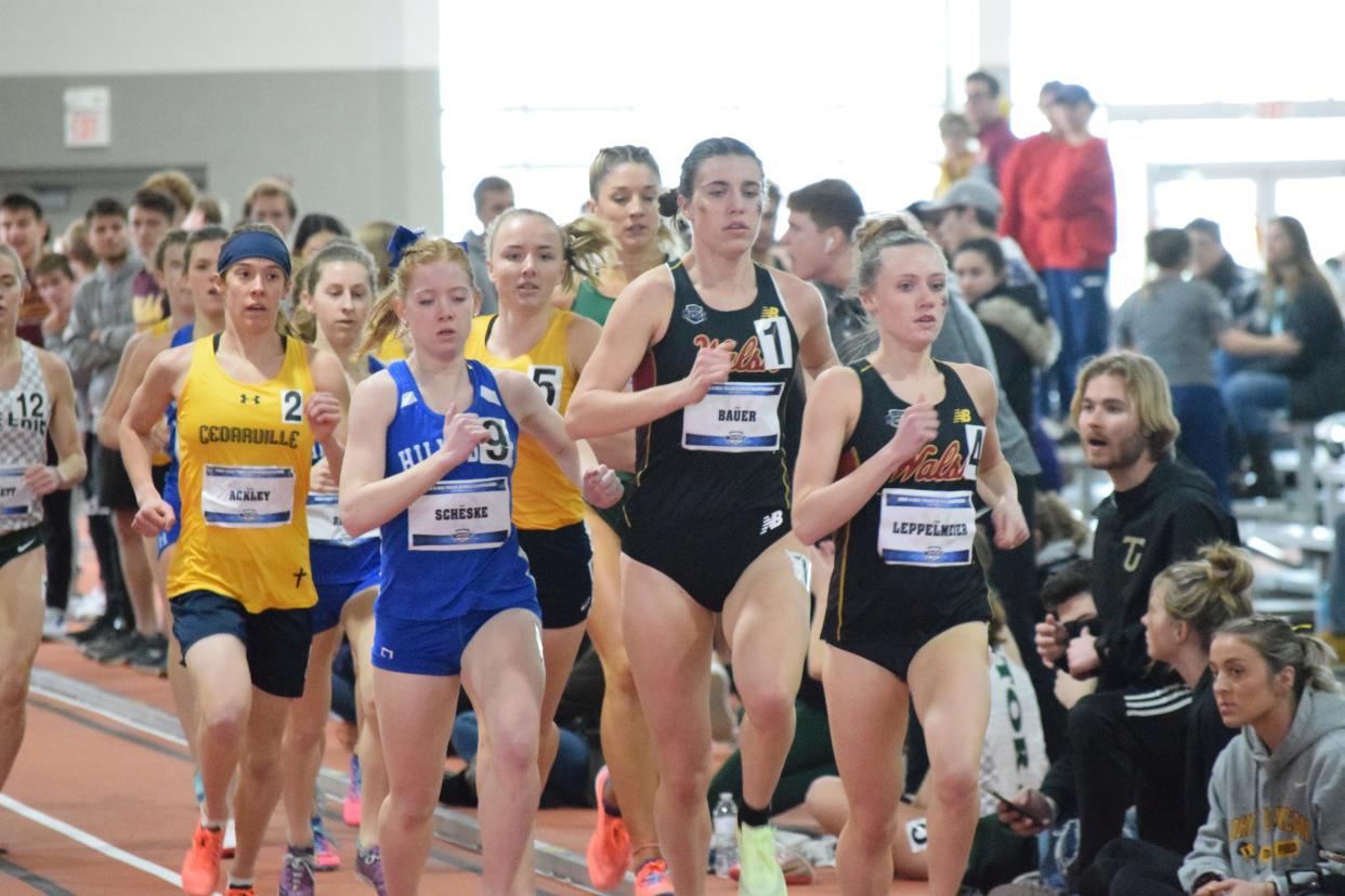Walsh's Alexa Leppelmeier (4) and Alex Bauer (1) finished 1-2 in the women's mile at the Great Midwest Athletic Conference Indoor Track and Field Championships.