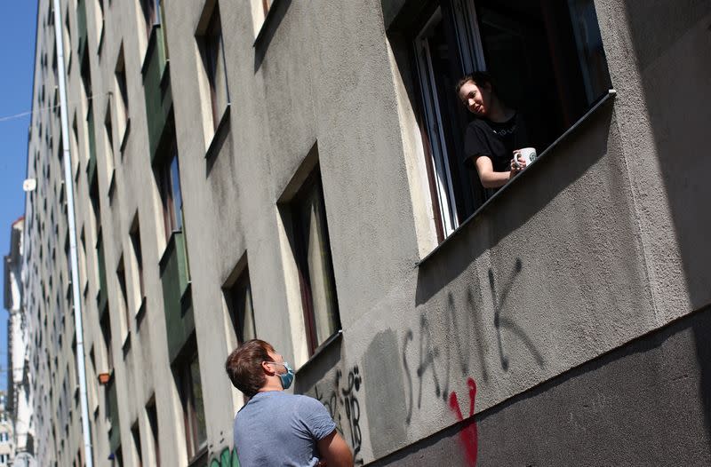 Residents chat while maintaining social distance during the global coronavirus disease (COVID-19) outbreak in Vienna