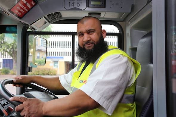 A BUS driver rushed a woman about to give birth to hospital late at night after she?d waited 75 minutes for an ambulance. Sajjad Shariff, 41, was driving the W15 down Grove Green Road, Leytonstone, east London, when frantic Fatim Faye, 44, waved him down at about 11pm. Distraught Miss Faye had just left her house on the same road in a desperate bid to get help. Mr Shariff said: ?She was staggering towards the stop. ?So I stopped early rather than drive past her. ?She got on and said ?baby? and ?hospital? and was breathing quickly and heavily.? Sajjad called ?code red? which alerts CentreComm, Transport for London?s emergency control room, and requested an ambulance. In control at the wheel - Sajjad in his bus.