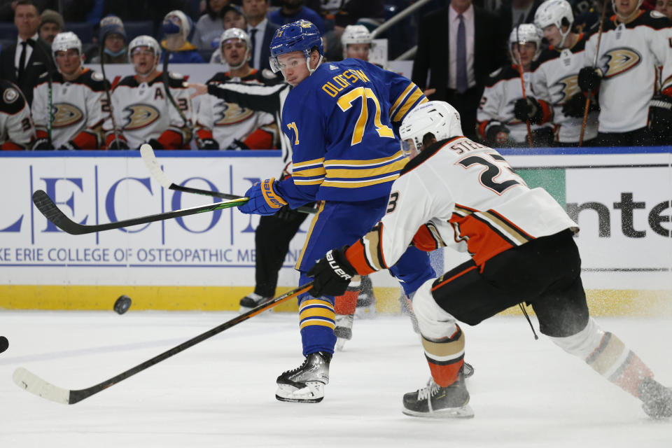 Buffalo Sabres right wing Victor Olofsson (71) passes the puck past Anaheim Ducks center Sam Steel (23) during the first period of an NHL hockey game Tuesday, Dec. 7, 2021, in Buffalo, N.Y. (AP Photo/Jeffrey T. Barnes)