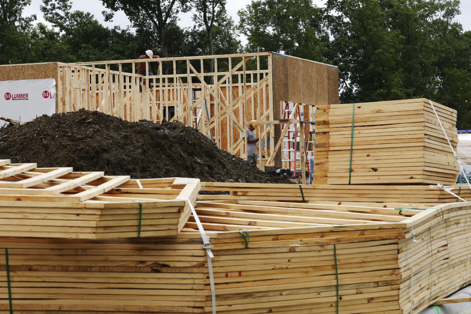 In this June 13, 2019, photo work continues on a new home in Mechanicsville, Va. On Tuesday, June 18, the Commerce Department reports on U.S. home construction in May. (AP Photo/Steve Helber)