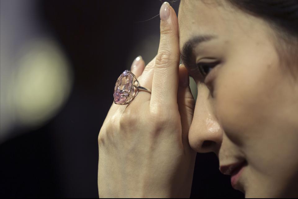 A model displays the Pink Star, a 59.60-carat internally flawless fancy vivid pink diamond during an auction preview at Sotheby's in Hong Kong, China, 29 March 2017. The Pink Star, the largest internally flawless fancy vivid pink diamond ever graded by the GIA, will go on sale in Hong Kong on 04 April and is estimated to fetch in excess of 60 million US dollars.Pink Star diamond at Sotheby's auction preview, Hong Kong, China - 29 Mar 2017