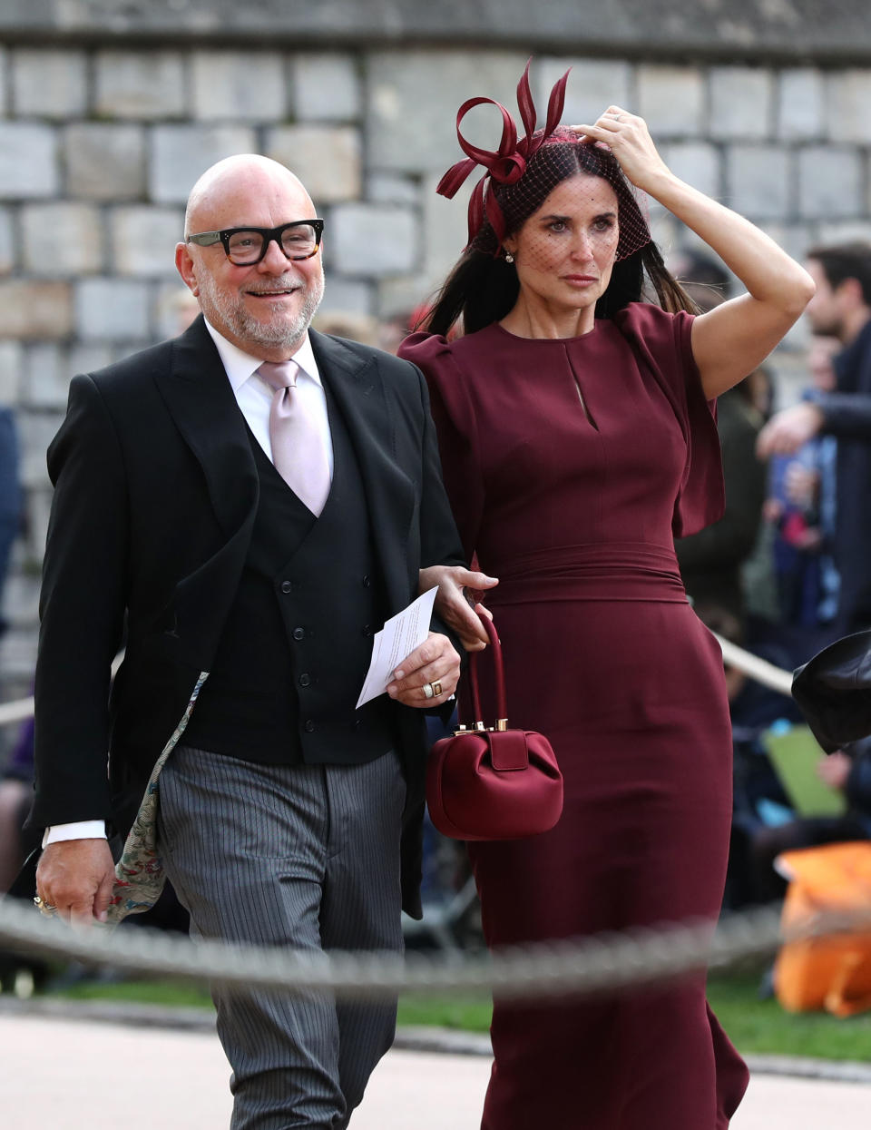 Demi Moore holds her fascinator in place. (Photo: Getty Images)