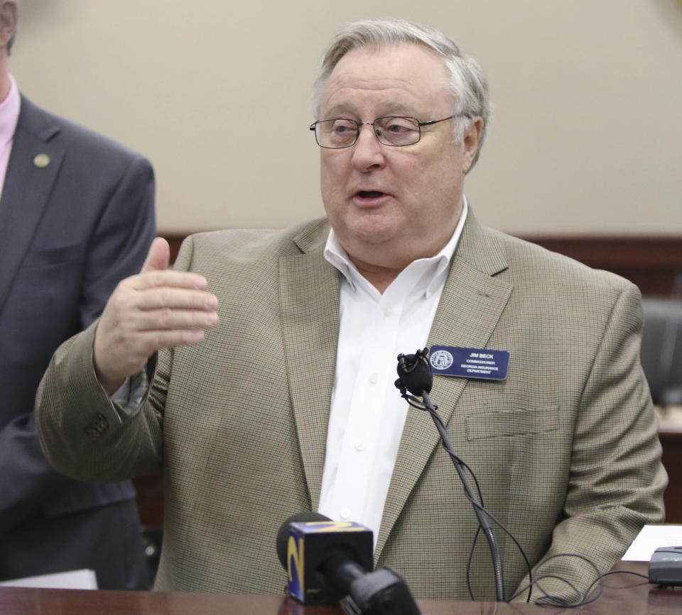 Jim Beck, commissioner of the Georgia Insurance Department, speaks at a press conference about an insurance fraud bust in a courtroom at the Clayton County Superior Court in Jonesboro, Ga., Friday, March 1, 2019. A federal judge has sentenced former Georgia Insurance Commissioner Beck to more than seven years in prison for fraud. The judge on Tuesday, Oct. 12, 2021, also ordered Beck to pay $2.6 million in restitution to make up for money he stole from an insurer. (Emily Haney/Atlanta Journal-Constitution via AP)