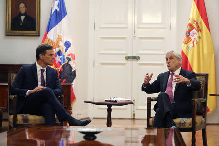 Chile's President Sebastian Pinera talks to Spain's Prime Minister Pedro Sanchez as they meet at the government house in Santiago, Chile August 27, 2018. REUTERS/Ivan Alvarado