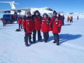 The Test Your limits team smile for a photo after arriving at Union Glacier.