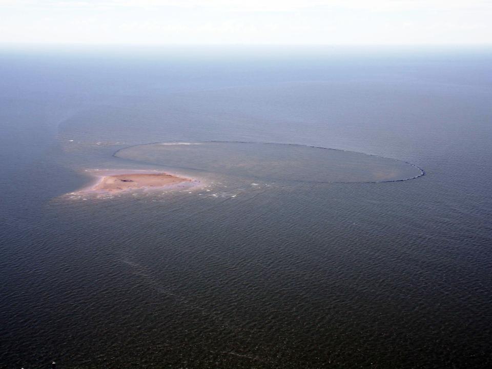 Wine Island is shown after Hurricane Isaac. The storm pushed the shoal out of the breakwater rocks that were meant to protect it.