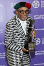 <p>Spike Lee holds up his award at the 46th Chaplin Award Gala honoring his career and legacy on Sept. 9 in N.Y.C. </p>