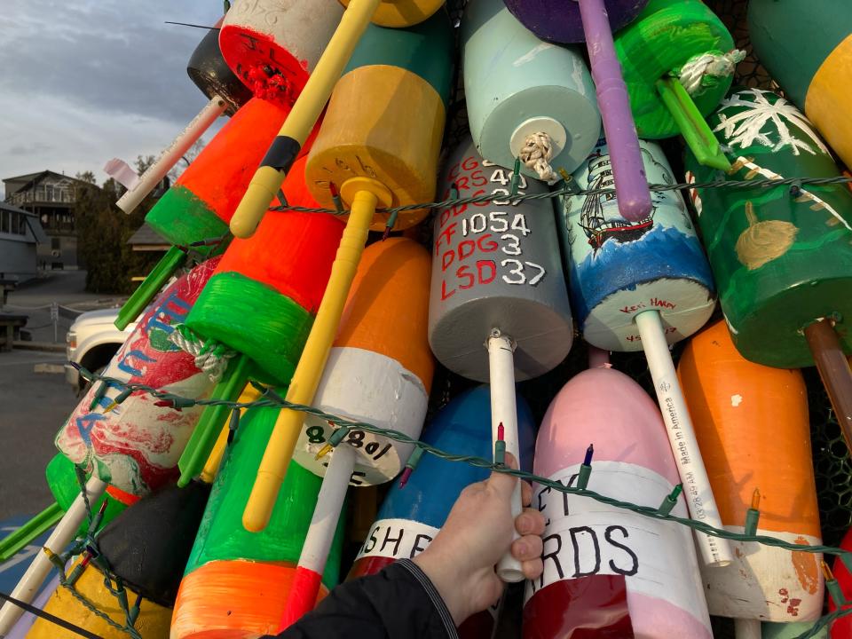 Decorated buoys on Kittery's first holiday lobster buoy tree, which was created to benefit the town's Wreaths Across America efforts, seen Tuesday, Dec. 1, 2021..