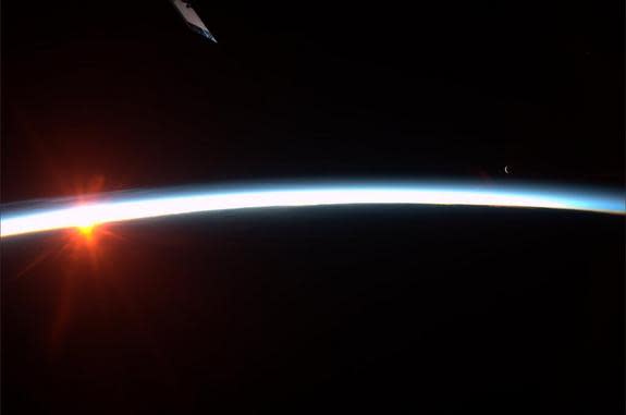 Astronaut Karen Nyberg tweeted this photo of the sunrise and moonrise as seen from the International Space Station. Image released Aug. 4, 2013.