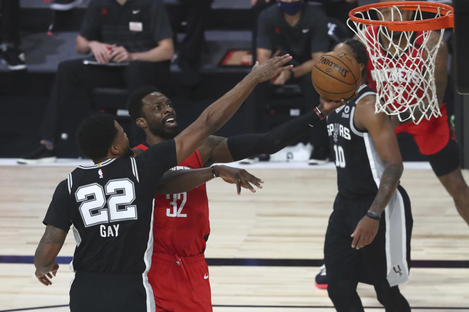 Houston Rockets forward Jeff Green (32) goes up for a shot while San Antonio Spurs forward Rudy Gay (22) defends during the first half of a NBA basketball game Tuesday, Aug. 11, 2020, in Lake Buena Vista, Fla. (Kim Klement/Pool Photo via AP)