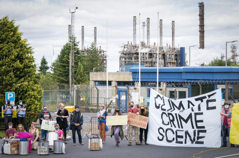 Climate activists demonstrating outside the gates of the Mossmorran chemical plant in Fife (Jane Barlow/PA) (PA Wire)