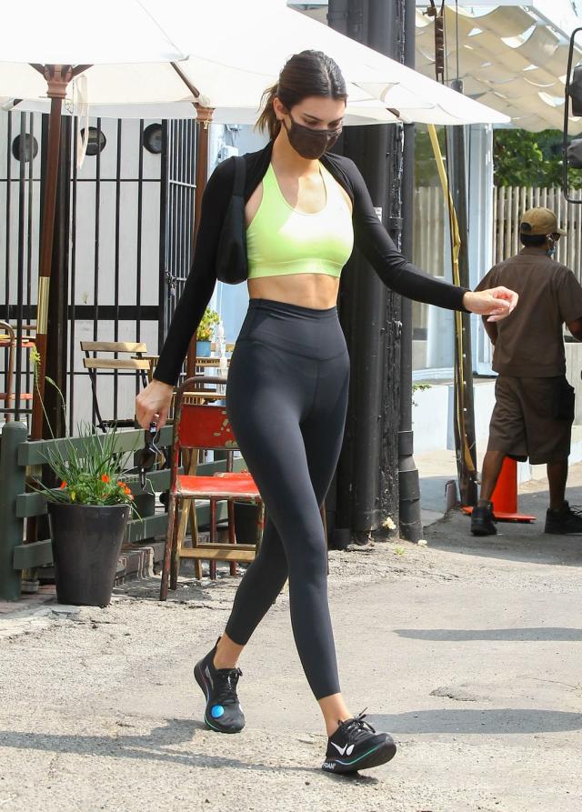 Kendall Jenner shows off chiseled abs in sports bra and spandex