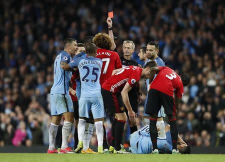 Britain Soccer Football - Manchester City v Manchester United - Premier League - Etihad Stadium - 27/4/17 Manchester United's Marouane Fellaini is shown a red card by referee Martin Atkinson Action Images via Reuters / Jason Cairnduff Livepic