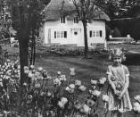 <p>A 10-year-old Princess Elizabeth (before her current reign as queen) on the grounds of the Royal Lodge in Windsor during a July trip. The Little Cottage (pictured behind the Princess) was gifted to Elizabeth and her sister, Princess Margaret, by the people of Wales in 1932.</p>