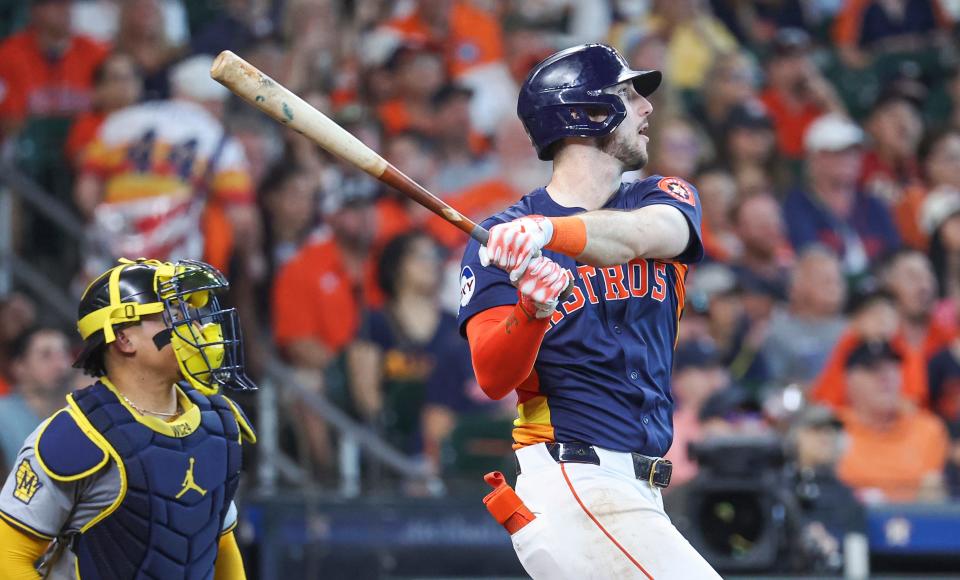 Astros rightfielder Kyle Tucker hits a three-run homer during the seventh inning against the Brewers at Minute Maid Park on Sunday afternoon.