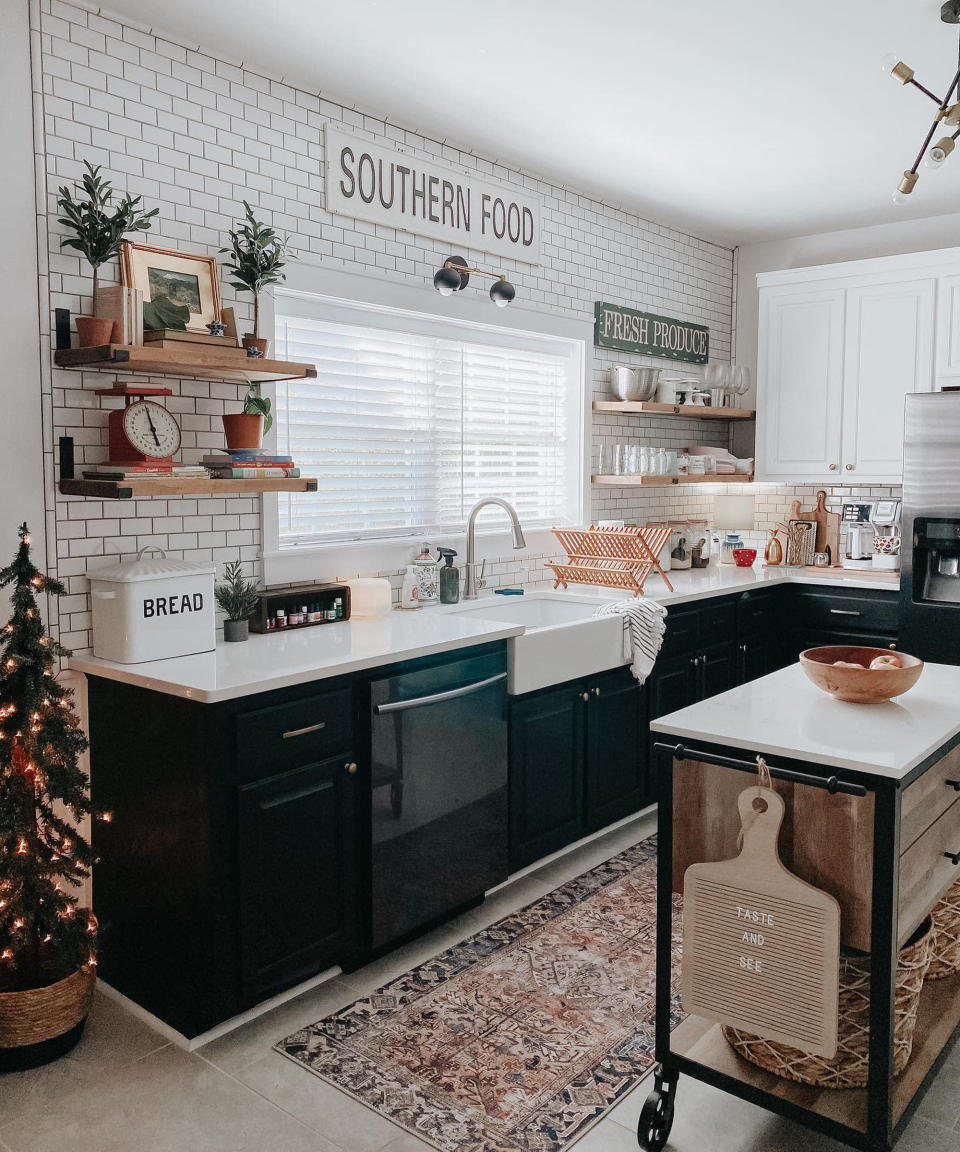 <p> In a mono or black kitchen scheme, add a layer of toasty-toe warming texture with a patterned rug to warm up stone flooring and add a homespun color pop. Choose a runner style to neatly fit between fixed cabinets and a central island. Incorporate natural materials like raw wood kitchen shelving and woven baskets, to layer up the warmth and introduce authentic texture at all levels.  </p>