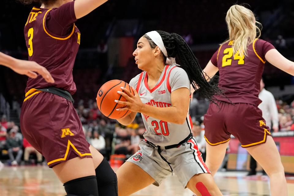 Feb 8, 2023; Columbus, OH, USA;  Ohio State Buckeyes guard Kaitlyn Costner (20) drives around Minnesota Golden Gophers guard Amaya Battle (3) during the first half of the NCAA women’s basketball game at Value City Arena. Mandatory Credit: Adam Cairns-The Columbus Dispatch