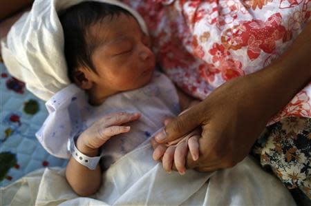 A newborn baby is pictured in Muslims Charity Hospital in Yangon November 1, 2013. REUTERS/Soe Zeya Tun