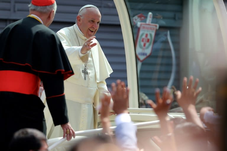 Pope Francis smiles at the crowd from the popemobile as he leaves the Senor de los Milagros Sanctuary in Lima, after a private meeting with contemplative nuns, on January 21, 2018, the final day of a visit to Peru and Chile