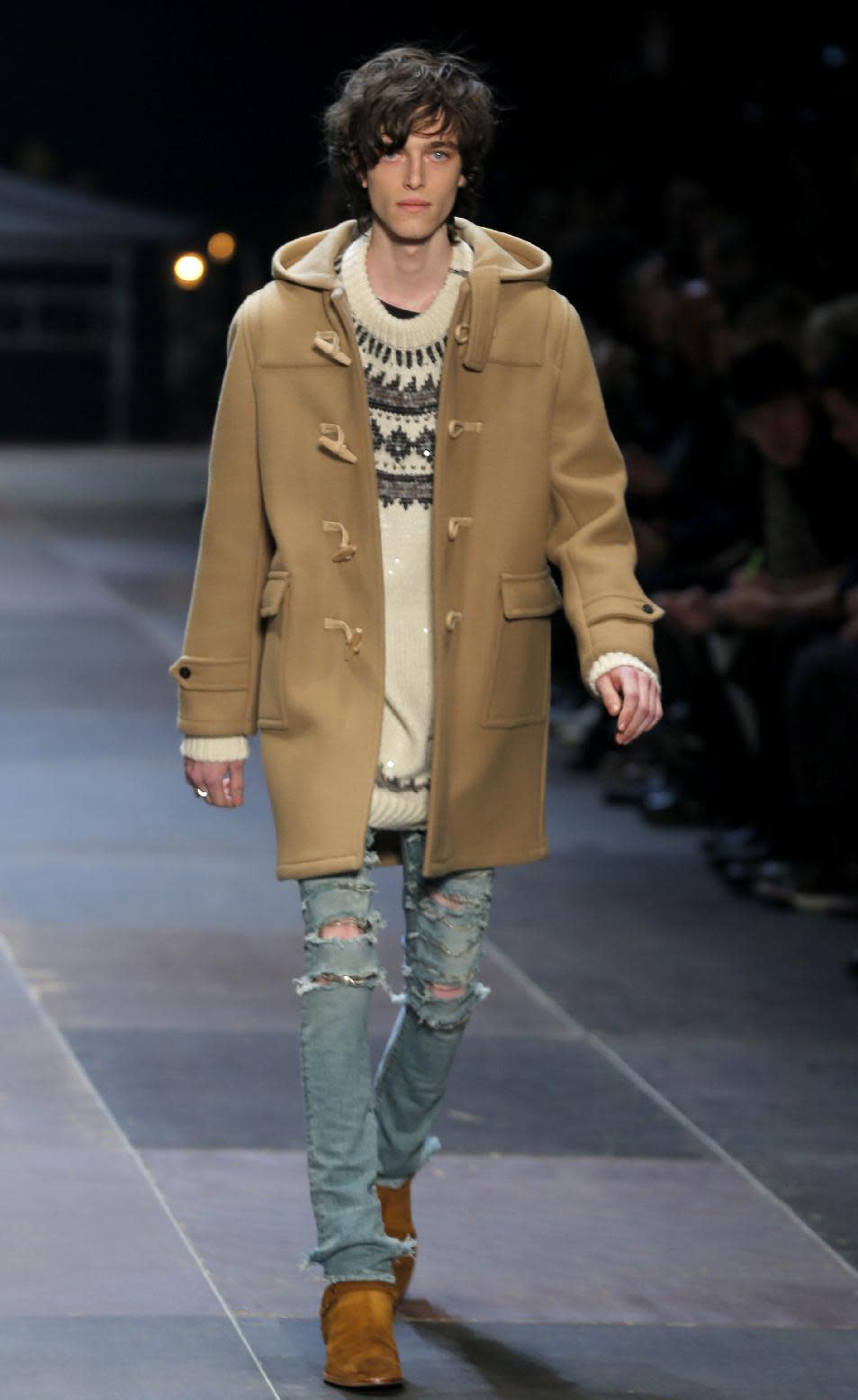 A model wears a creation by Born French fashion designer Hedi Slimane for St Laurent as part of the Men's fall-winter 2013-2014 fashion collection presented in Paris, Sunday, Jan. 20 2013 (AP Photo/ Jacques Brinon)