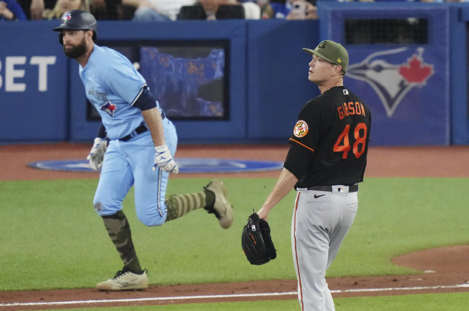 Toronto Blue Jays' Brandon Belt watches his double off Baltimore Orioles starting pitcher Kyle Gibson (48) during the second inning of a baseball game Friday, May 19, 2023, in Toronto. (Chris Young/The Canadian Press via AP)