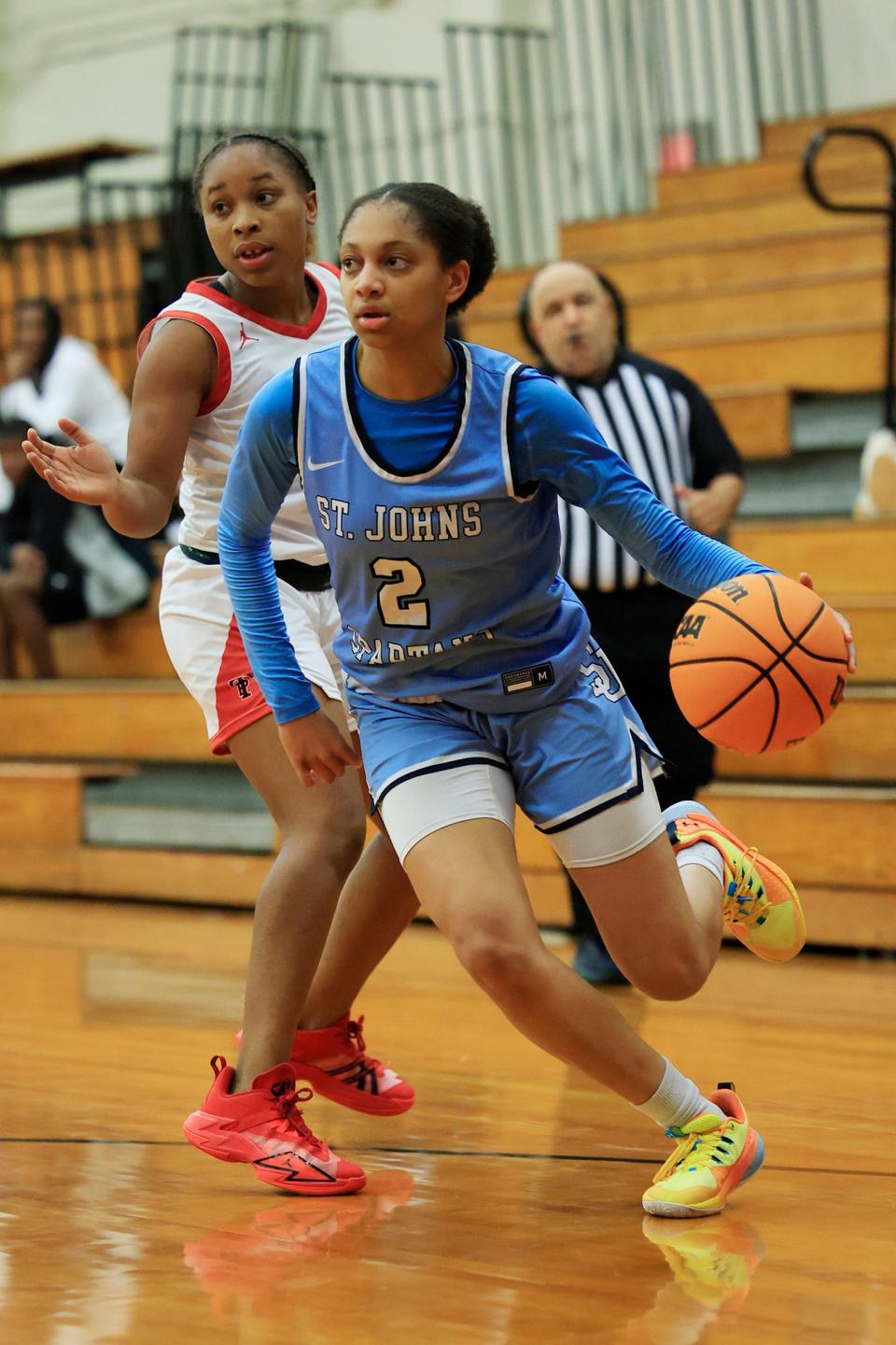 St. Johns Country Day's Taliah Scott (2) dribbles to the hoop against Parker. The Spartans senior became the fifth area athlete to win the Florida Dairy Farmers Miss Basketball award.