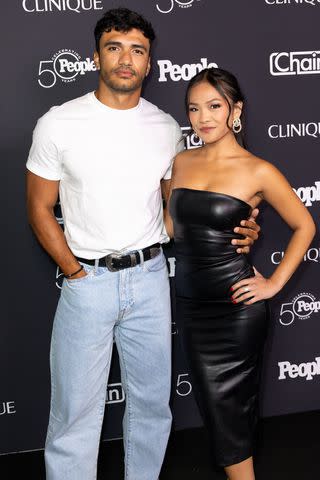 <p>Elyse Jankowski/Getty</p> (L-R) Jonathon Johnson and Jenn Tran at the People + Chain celebration of People's 50th anniversary held at The Chain House on September 13, 2024.