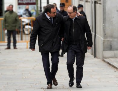 Catalan politicians Josep Rull (L) and Jordi Turull arrive together to the Supreme Court after being summoned and facing investigation for their part in Catalonia's bid for independence in Madrid, Spain, March 23, 2018.  REUTERS/Susana Vera