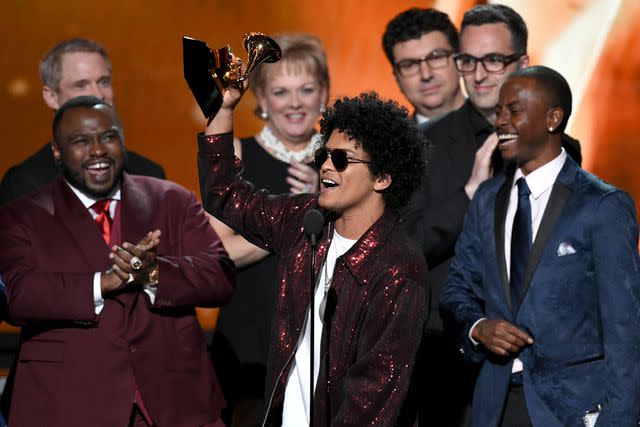 <p>Kevin Winter/Getty </p> James Fauntleroy, Bruno Mars, and others celebrate 2018 Grammy win for Album of the Year