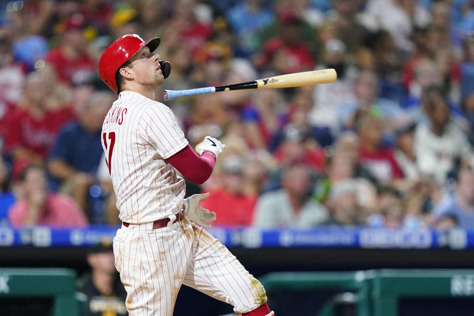 Philadelphia Phillies' Rhys Hoskins tosses his bat after hitting a fly out against Pittsburgh Pirates pitcher Zach Thompson during the fourth inning of a baseball game, Friday, Aug. 26, 2022, in Philadelphia. (AP Photo/Matt Slocum)