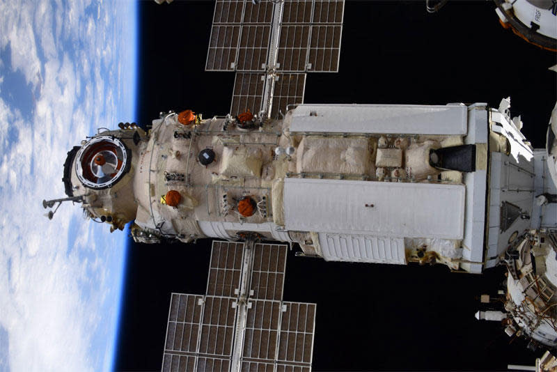 The Russian Nauka multi-purpose laboratory module, seen here, docked at the International Space Station early Thursday. A software error caused unexpected thruster firings later, when the module was out of direct contact with Russian flight controllers, which briefly knocked the station out of its normal orientation. / Credit: Oleg Novitskiy/Twitter