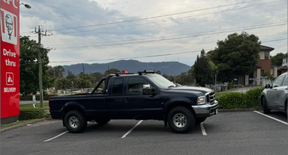 American style ute parked across four car parking bays outside KFC Mooroolbark in Melbourne