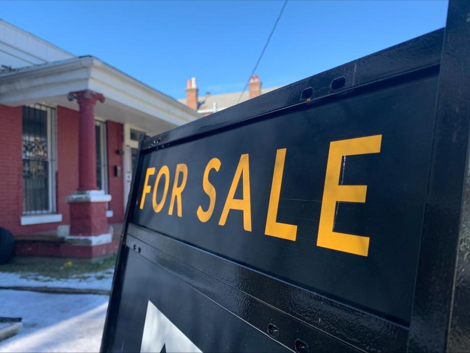 A "For Sale" sign stands outside a home by Louisville's Shelby Park neighborhood. Feb. 8, 2022