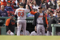 Baltimore Orioles' Kyle Stowers is welcomed to the dugout after scoring in the third inning of a baseball game against the Boston Red Sox, Thursday, Sept. 29, 2022, in Boston. (AP Photo/Steven Senne)