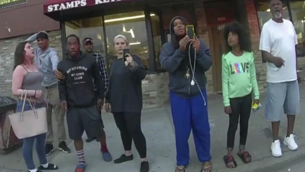 <span class="caption">An image from a police body camera shows bystanders including Darnella Frazier, third from right, filming a Minneapolis police officer pressing his knee on <span class="caas-xray-inline-tooltip"><span class="caas-xray-inline caas-xray-entity caas-xray-pill rapid-nonanchor-lt" data-entity-id="George_Floyd" data-ylk="cid:George_Floyd;pos:1;elmt:wiki;sec:pill-inline-entity;elm:pill-inline-text;itc:1;cat:Musician;" tabindex="0" aria-haspopup="dialog"><a href="https://search.yahoo.com/search?p=George%20Floyd" data-i13n="cid:George_Floyd;pos:1;elmt:wiki;sec:pill-inline-entity;elm:pill-inline-text;itc:1;cat:Musician;" tabindex="-1" data-ylk="slk:George Floyd;cid:George_Floyd;pos:1;elmt:wiki;sec:pill-inline-entity;elm:pill-inline-text;itc:1;cat:Musician;" class="link ">George Floyd</a></span></span>'s neck.</span> <span class="attribution"><a class="link " href="https://newsroom.ap.org/detail/GeorgeFloydOfficerTrialNelson/ca9d6a445a60478092510cd46683dc0f/photo?Query=Darnella%20AND%20Frazier&mediaType=photo&sortBy=arrivaldatetime:asc&dateRange=Anytime&totalCount=4&currentItemNo=1" rel="nofollow noopener" target="_blank" data-ylk="slk:Minneapolis Police Department via AP, File;elm:context_link;itc:0;sec:content-canvas">Minneapolis Police Department via AP, File</a></span>