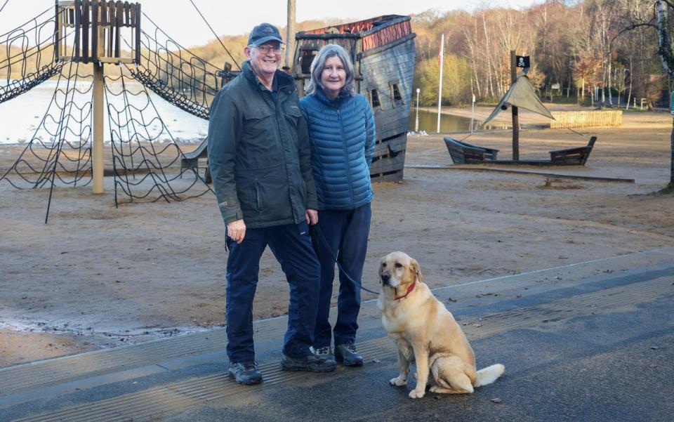 Andrew and Jackie Marchant with their dog, Loki