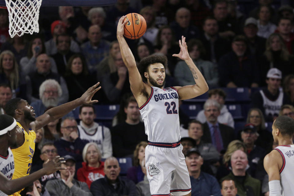 Gonzaga forward Anton Watson (22) grabs a rebound during the first half of an NCAA college basketball game against Cal State Bakersfield, Tuesday, Nov. 28, 2023, in Spokane, Wash. (AP Photo/Young Kwak)